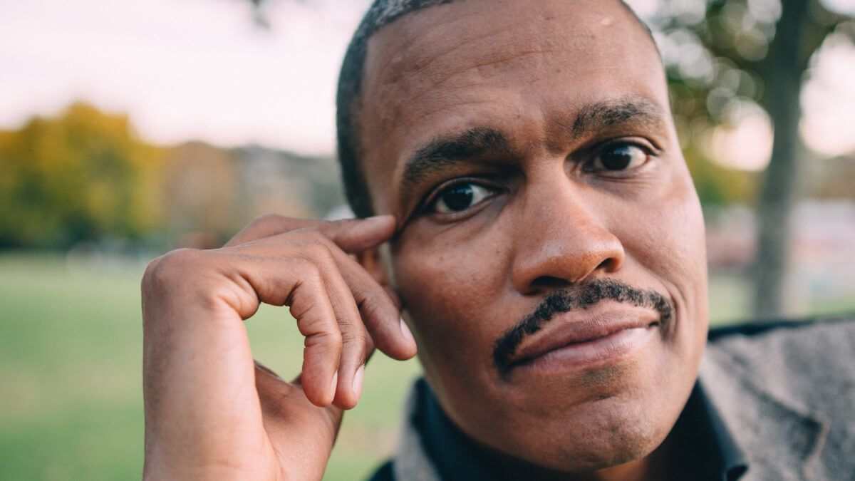 Close up of Black man with moustache  