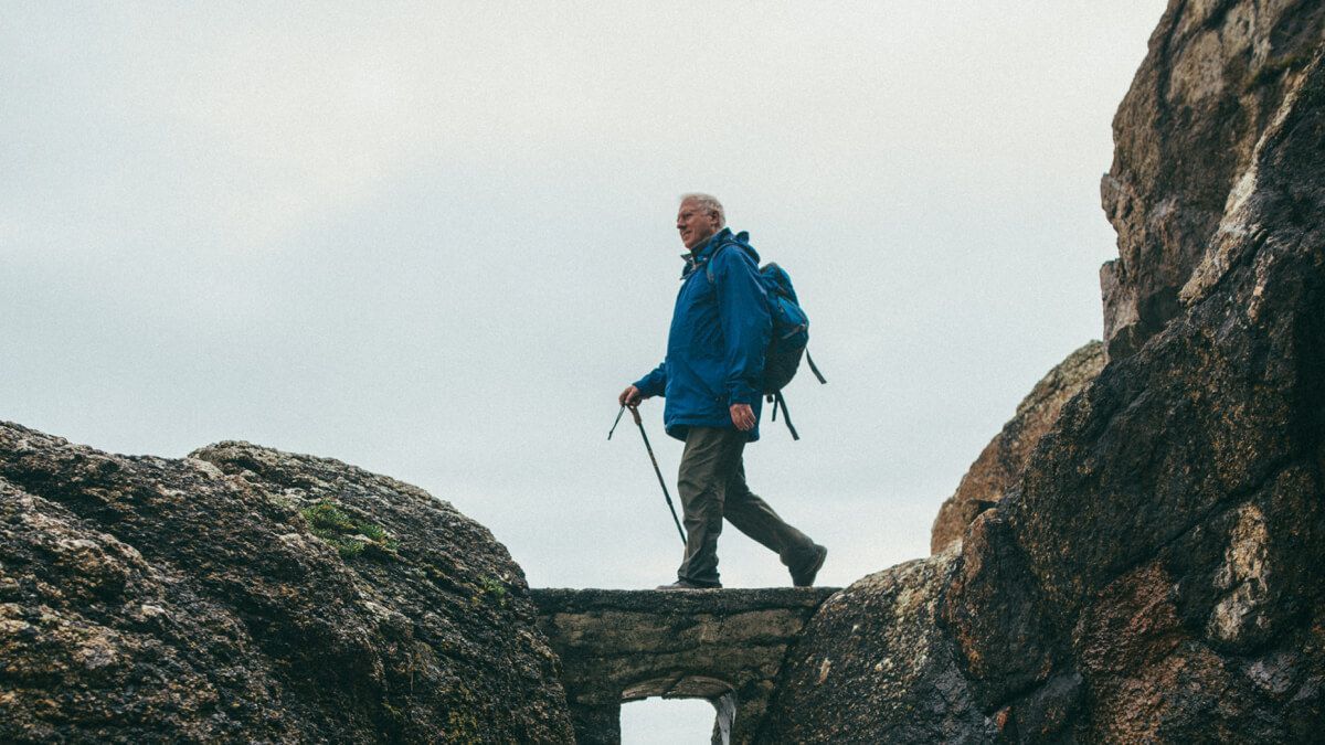 Man with backpack hiking outdoors