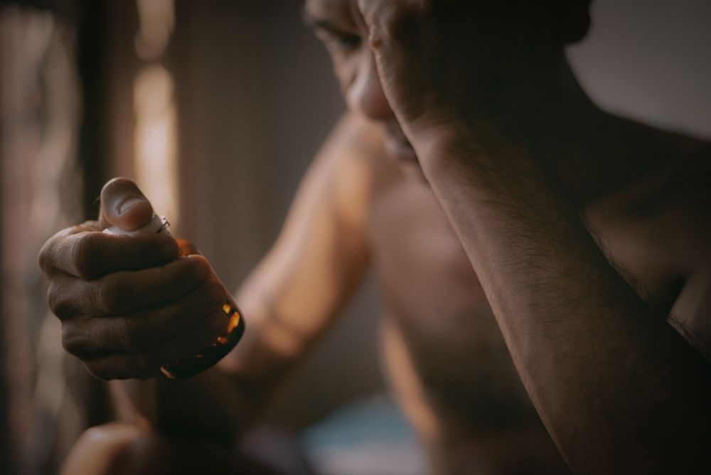 Person looking at bottle of pills